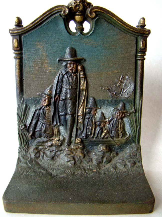 A pair of cast iron bookends circa 1930 by Bradley & Hubbard depicting the Mayflower and the Pilgrims landing at Plymouth. — image 2